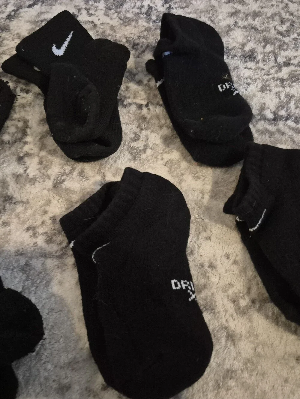 8 pairs of Nike black xs socks and 3 extra no matches socks